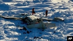 This photo provided by the US Coast Guard on Feb. 7, 2025, shows a small commuter plane that crashed in western Alaska on a flight that was bound for the hub community of Nome. 