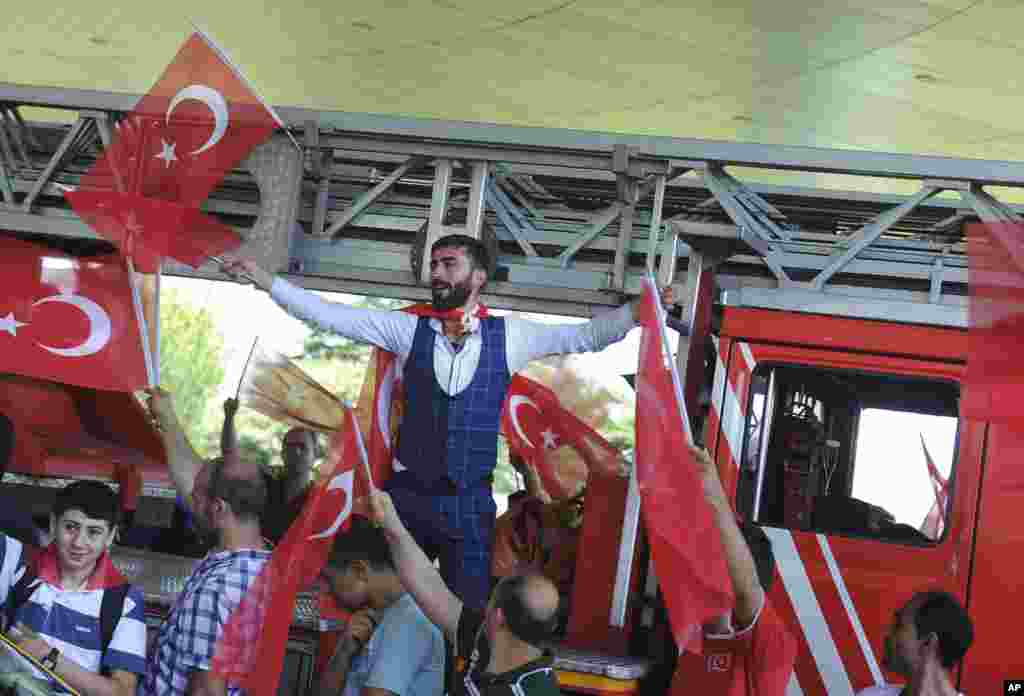 People against the attempted coup celebrate at Istanbul's Ataturk airport, July 16, 2016.