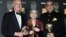 (L-R) James Ivory, Ruth Prawer Jhabvala and Ismail Merchant, who together form Merchant Ivory Productions, receive a British Academy film fellowship at a ceremony in central London, February 24, 2002. 