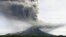 Mount Sinabung spews volcanic material as it erupts as seen from Tiga Pancur, North Sumatra, Indonesia, Nov. 18, 2013. 