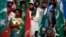 Supporters of Pakistani religious party Jamaat-e-Islami (JI) and the Pakistan Tehreek-e-Insaf (PTI) political party of former cricket star Imran Khan, listen to their leaders speak during a protest in Karachi, Nov. 24, 2013. 