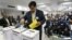 Lalit Bhanot, who was recently elected as the secretary general of the Indian Olympic Association (IOA), casts his ballot for the election of Vice President, Joint Secretary and Executive Council members of IOA in New Delhi, India, December 5, 2012.