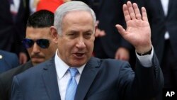 Israeli Prime Minister Benjamin Netanyahu waves to the media as leaves the presidential palace after a meeting with Greek Prime Minister Alexis Tsipras and Cyprus' president Nikos Anastasiades in capital Nicosia, Cyprus, May 8, 2018. 