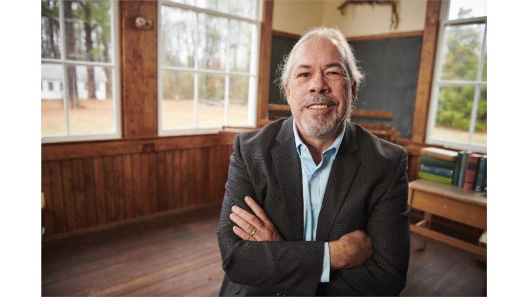 Undated photo shows Pamunkey Chief Robert Gray inside the restored one-room schoolhouse on the Pamunkey Indian Reservation in Kent County, Va.