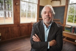 Undated photo shows Pamunkey Chief Robert Gray inside the restored one-room schoolhouse on the Pamunkey Indian Reservation in Kent County, Va.