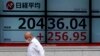 Asian Markets Mixed Wednesday Over Continued Pandemic Worries 