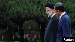 FILE - Iran President Ebrahim Raisi, left, meets Indonesia President Joko Widodo in Bogor, Indonesia, May 23, 2023. Iranian leaders have intensified their diplomatic activity by visiting other leaders this year.