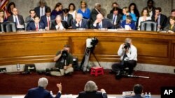 FILE - From left, Secretary of State John Kerry, Secretary of Energy Ernest Moniz and Secretary of Treasury Jack Lew testify at a Senate Foreign Relations Committee hearing to review the Iran nuclear agreement, in Washington, July 23, 2015.