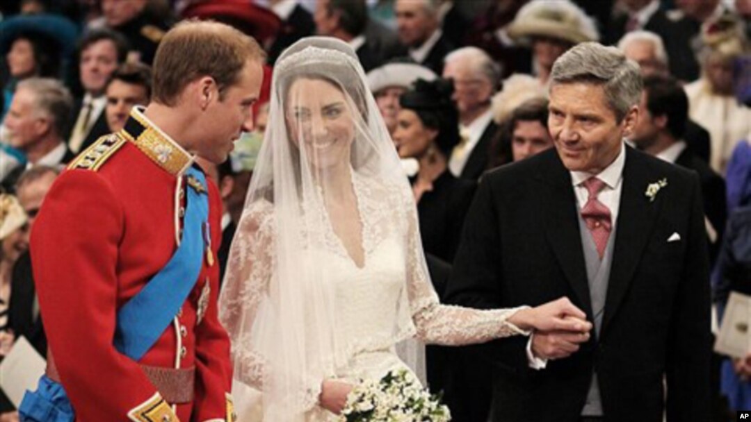 Prince William greets Kate Middleton as she arrives at the alter with her father Michael Middleton, prior to their marriage in London's Westminster Abbey, Friday April 29 2011.(AP Photo/ Dominic Lipinski, pool)