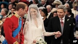 Prince William greets Kate Middleton as she arrives at the alter with her father Michael Middleton, prior to their marriage in London's Westminster Abbey, Friday April 29 2011.(AP Photo/ Dominic Lipinski, pool)