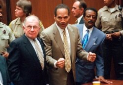 FILE - O.J. Simpson reacts as he is found not guilty in the death of his ex-wife Nicole Brown Simpson and her friend Ron Goldman in Los Angeles. Defense attorneys F. Lee Bailey, left, and Johnnie L. Cochran Jr. stand with him.