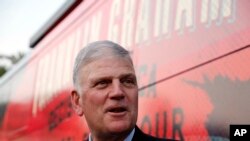  The Rev. Franklin Graham talks to the media before he speaks at his Decision America event at the Pitt County Fairgrounds in Greenville, N.C., Oct. 2, 2019. 