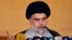 Iraqi Shiite cleric and political leader Moqtada al-Sadr delivers the Eid al-Fitr sermon during the Muslim holiday's morning prayer at the Grand Mosque of Kufa near the central shrine city of Najaf, June 5, 2019.