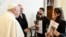 This photo taken and handout on April 8, 2024 by The Vatican Media shows Pope Francis during a meeting with relatives of Israeli hostages from the Bibas family (Shiri, Yarden, Ariel, Kfir), Omri Miran, Agam Berger, Guy Gilboa Dalal and Tamir Nimrodi, held