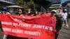 FILE - People hold a banner during a public rally held for the Myanmar community in Australia calling for ASEAN to not support the Myanmar Military Junta, outside the ASEAN-Australia Special Summit venue, in Melbourne, Australia March 4, 2024.