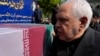 FILE - Mohammad Javad Zarif, now Iran's vice president for strategic affairs, pauses at the coffin of Foreign Minister Hossein Amirabdollahian, who was killed in a helicopter crash, on May 23, 2024, in Tehran. Zarif on Nov. 9 called on Donald Trump to reassess his stance on Iran.