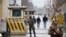 Afghan security forces keep watch at a check point near the site of a suicide attack in Kabul, Afghanistan, Feb. 24, 2018. 