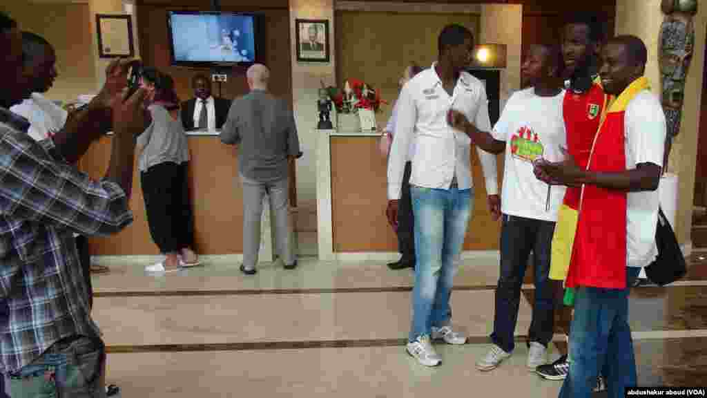 Fans with Guinea Conakry striker in Malabo