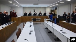 Judge Doris Husch, center, presides over the chamber court trial of four alleged Hamas members suspected of organizing weapons caches across Europe, in Berlin on Feb. 25, 2025.