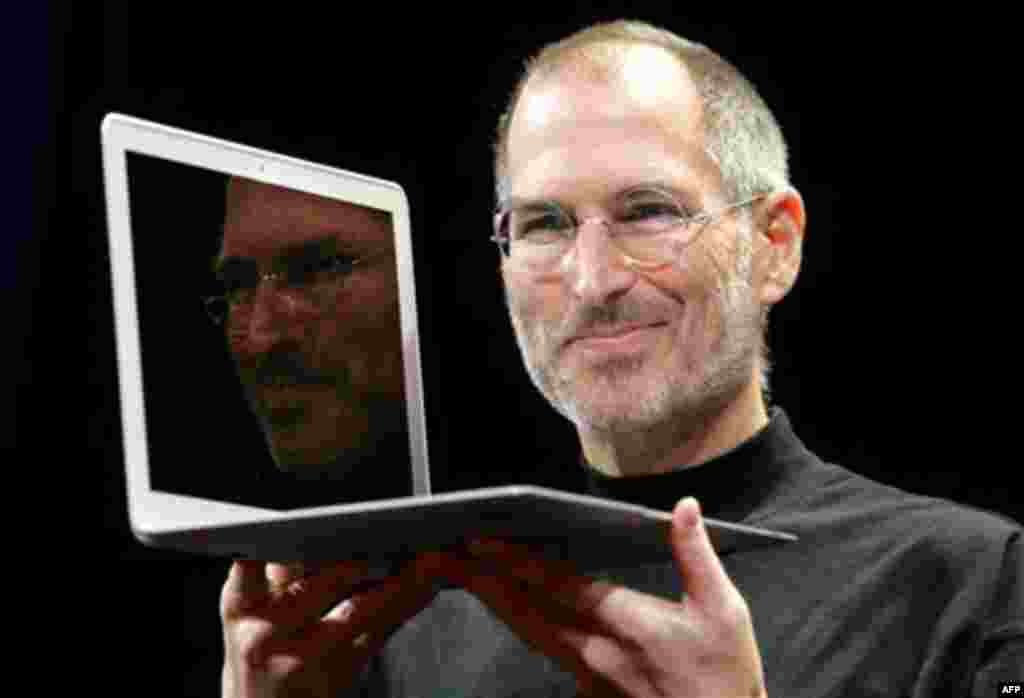 FILE - In this Jan. 15, 2008, file photo, Apple CEO Steve Jobs holds up the new MacBook Air after giving the keynote address at the Apple MacWorld Conference in San Francisco. Apple on Wednesday, Oct. 5, 2011 said Jobs has died. He was 56. (AP Photo/Jeff 