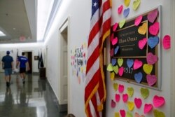 Notes line the wall outside the office of Rep. Ilhan Omar, D-Minn., July 19, 2019, part of a day-long solidarity vigil organized by anti-war protest group Code Pink, on Capitol Hill in Washington.
