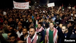 Protesters shout slogans during a protest in Amman, Jordan, June 4, 2018.