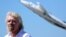 FILE - Richard Branson listens to speeches as he is inducted into the Flight Path Walk of Fame at Los Angeles Airport Flight Path Museum, Los Angeles, March 28, 2018.