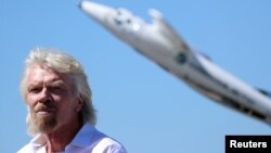 Richard Branson listens to speeches as he is inducted into the Flight Path Walk of Fame at Los Angeles Airport Flight Path Museum, Los Angeles, March 28, 2018.