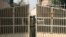 FILE - An Indian police officer is seen closing the gates of a prison in New Delhi, India, in a March 11, 2013, photo.