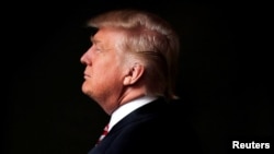 Then-Republican U.S. presidential candidate Donald Trump poses for a photo in his office in Trump Tower, in the Manhattan borough of New York City, May 17, 2016. A 1989 portrait of him will soon be on display at the Smithsonian.