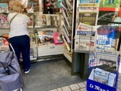 A newspaper kiosk is seen in Paris, June 20, 2021, with the France's regional elections topping the news. (Lisa Bryant/VOA)