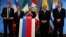 FILE - Chile's Finance Minister Felipe Larrain (C) prepares to speak while flanked by his regional counterparts during a news conference on the first meeting of the finance ministers of the Pacific Alliance in Santiago, Aug. 23, 2013. 