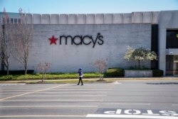 FILE - The Macy's store at the popular Tyson's Corner Center sits closed Monday, March 30, 2020, in McLean, Va., a Washington, D.C., suburb.