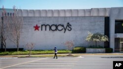 The Macy's store at Tyson's Corner Center sits closed, March 30, 2020, in McLean, Virginia, a Washington, D.C., suburb. Macy's announced that they would furlough a majority of their 130,000 workers after their stores closed due to the virus outbreak. 