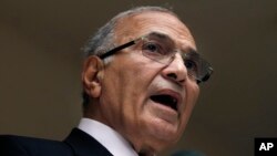 FILE - In this May 26, 2012, photo, then-Egyptian presidential candidate Ahmed Shafik speaks to the media during a press conference at his office in Cairo, Egypt. 