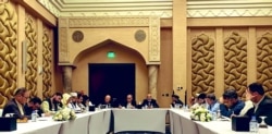 A handout picture provided by the Afghanistan Peace Negotiation Team on Sept. 15, 2020 shows negotiators from the government of Afghanistan preparing before their meeting with representatives of the Taliban (unseen) in Qatar's capital Doha.