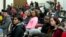 In this March 24, 2015 photo, University of Maryland students listen to speakers during a town hall meeting about racism in universities and what can be done to stop it, at University of Maryland in College Park, Md. 