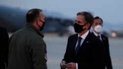 U.S. Secretary of State Antony Blinken talks with Lieutenant General Scott Pleus, the deputy commander of United States Forces Korea, before he boards a plane at the Osan Air Base in Pyeongtaek, South Korea, Thursday, March 18, 2021