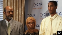 FILE - Abdirizak Wehelie and Shamsa Noor attend a news conference about their son Yahya Wehelie, as their son Yusuf speaks, in Washington, June 16, 2010. 