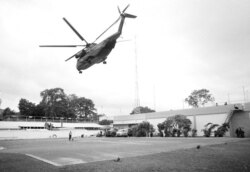 FILE - The helicopter zone at the U.S. Embassy in Saigon, Vietnam, showing the last-minute evacuation of authorized personnel and civilians, April 29, 1975.