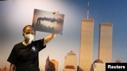 Docent Joan Mastropaolo shares her first-person account of the September 11, 2001, attacks with students during a tour at the 9/11 Tribute Museum in New York City, August 26, 2021. (REUTERS/Caitlin Ochs)