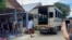 In this photo released by the San Sai District Administrative Office, journalists working for  Democratic Voice of Burma, prepare to get into a van after being arrested at San Sai District in Chiang Mai province north of Thailand Sunday, May 9, 2021.