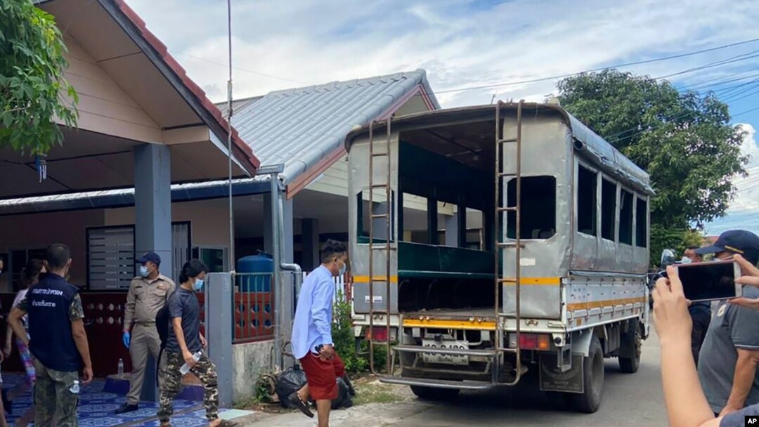 In this photo released by the San Sai District Administrative Office, journalists working for Democratic Voice of Burma, prepare to get into a van after being arrested at San Sai District in Chiang Mai province north of Thailand May 9, 2021.