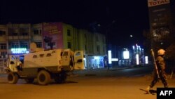 Army forces drive near Hotel Splendid in Burkina Faso's capital Ouagadougou, after gunmen stormed the hotel and took several hostages January 15, 2016