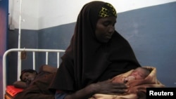 Somali woman holds a newly born baby. (file)