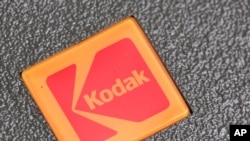FILE - In this Jan. 25, 2011 file photo, a Kodak logo is shown on a slide projector in Philadelphia. Embattled photography pioneer Eastman Kodak Co. is nearing the end of a high-stakes patent-infringement fight Thursday, June 30, 2011, with tech…
