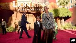 Beyonce (R) and her daughter Blue Ivy Carter arrive at the world premiere of "The Lion King" on July 9, 2019, at the Dolby Theatre in Los Angeles, California. 