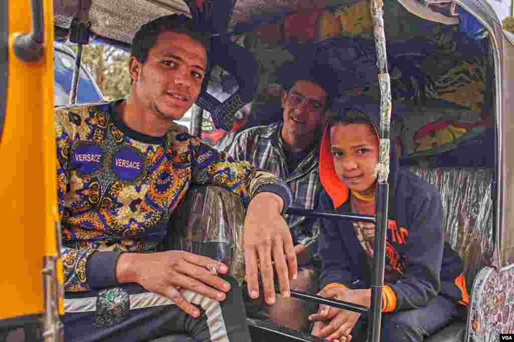 Toktok driver Akram says, &quot;Driving toktok is much better than wasting time with friends on coffee shops or sharing a rolled cigarette. On my toktok, I can make money.&quot; (H. Elrasam/VOA)