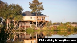 A typical home by the bayou, built high on stilts to protect from flooding in southern Louisiana, Nov. 15, 2017.