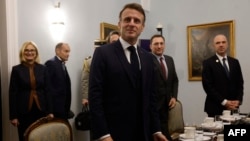 French President Emmanuel Macron attends a meeting at the presidential palace in Warsaw, Poland, on Dec. 12, 2024. Macron cut short the visit to Poland to return to France to name a new prime minister. 